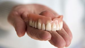 Four partial dentures on white background 