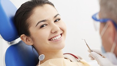 Smiling woman in dental chair