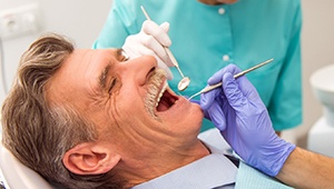 Relaxed older man in dental chair