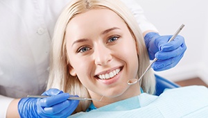 Smiling woman in dental exam room