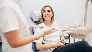 Lady smiles at dentist