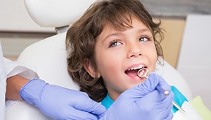 Child smiling during dental exam