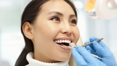 Woman receiving dental exam