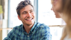 man smiling after getting dental implants in Phoenix