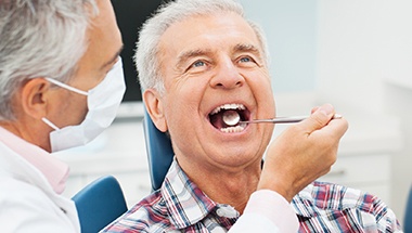 Senior man receiving dental exam