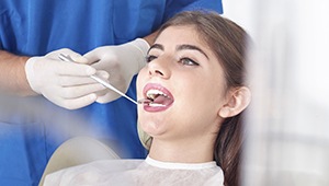 Woman receiving dental exam