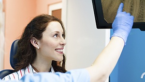 Patient looking at root canal x-rays