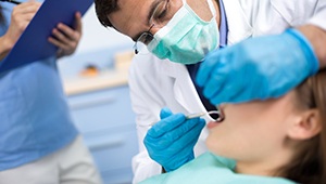 Dentist providing root canal therapy