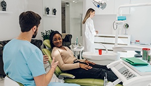 Dentist and patient engaged in conversation