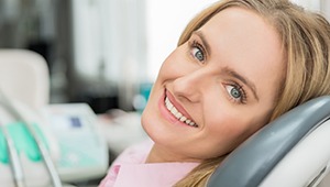 Smiling woman in dental exam room