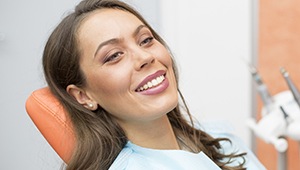 Relaxing woman smiling in dental chair
