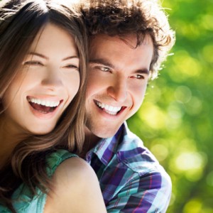 a couple with beautiful smiles thanks to the dentist sun city resident prefer Smile Fitness Dental Centers