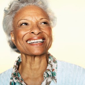 senior woman smiling with dentures from Smile Fitness Dental Center