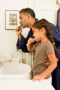 Father and daughter great tooth brushing skills from Smile Fitness Dental Center