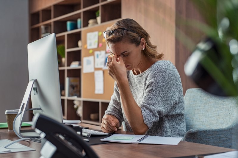 Woman experiencing stress at work