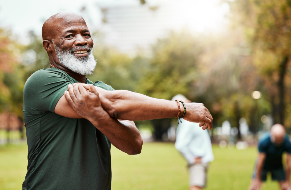 Senior man stretching in park